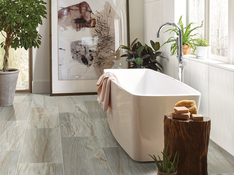 standalone beige tub on tile floors - Carpet Plus Flooring LLC